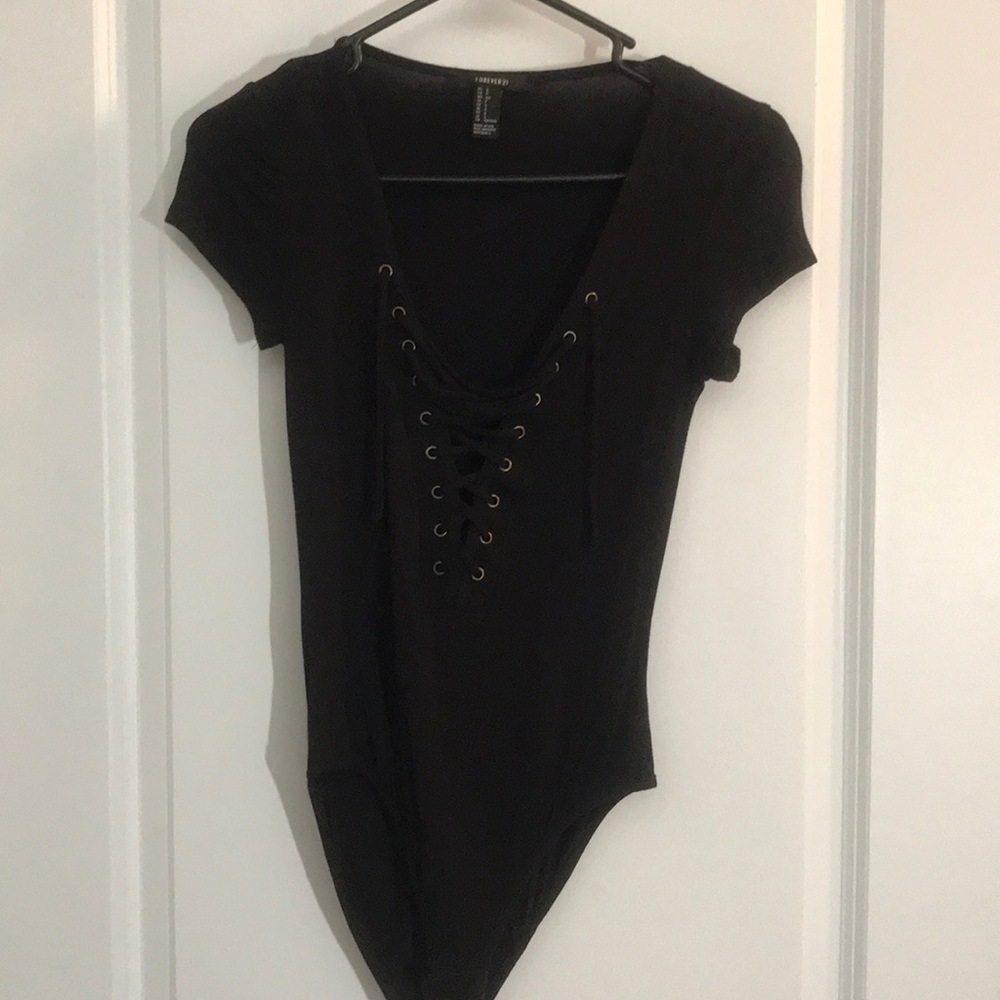Lace up body suit. Forever 21. Never worn, NWOT